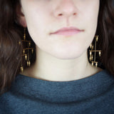 Model wearing Bullet La Donna earrings designed by Jessica Rose
