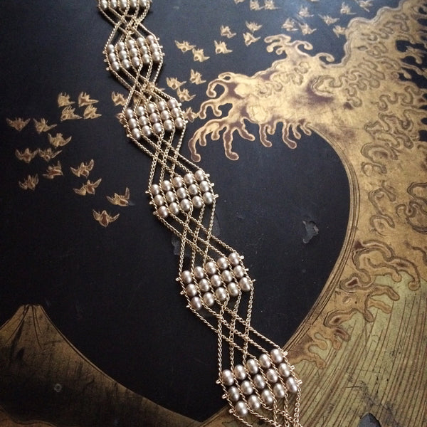 Woven chain and pearl bracelet