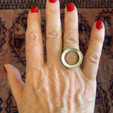 Empty Bezel ring in matte sterling silver, shown on hand