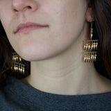 Model wearing Jessica Rose bullet 3 Sails Earrings