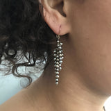 Model wearing pearl Icicle earrings